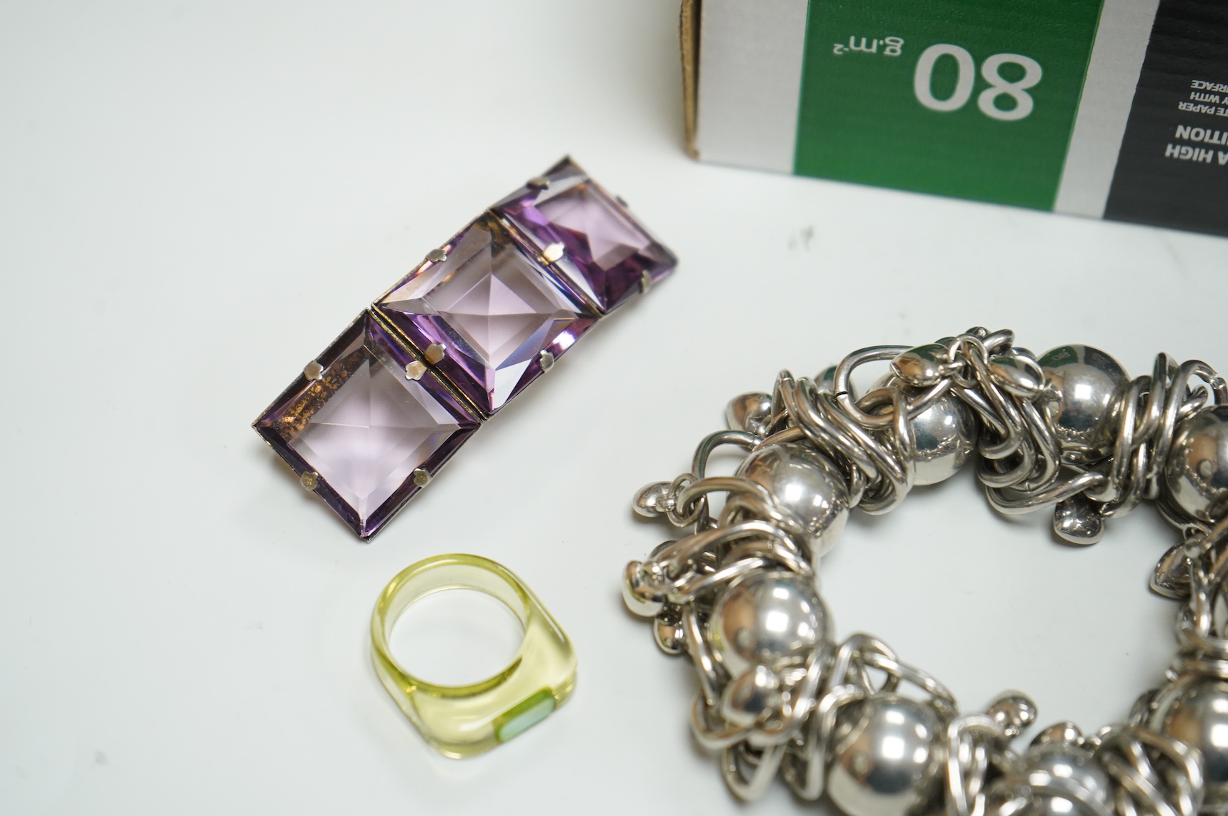 A collection of assorted costume jewellery, including a pair of spherical amethyst drop earrings, a modern silver mounted aide memoire, brooches, necklaces, rings et.
